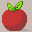 The apple with darker red shading on the bottom right and a grey shadow on the ground